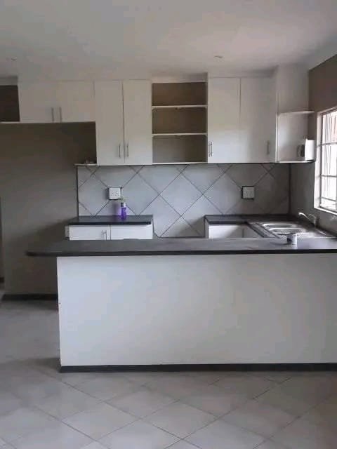 Built‑in wardrobe with sliding doors and drawers